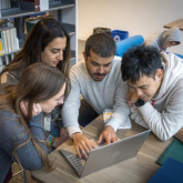 DEDP master's students engaged in dynamic group work on campus.